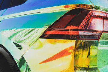 Chameleon holographic colour car. Rear view closeup. Beautiful modern LED backlights. Car wrapping....