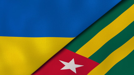 The flags of Ukraine and Togo. News, reportage, business background. 3d illustration