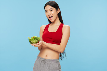 young woman holding a salad