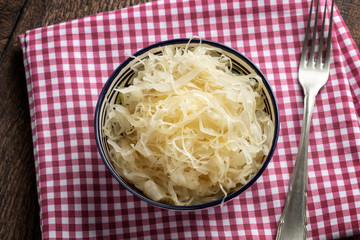Fermented cabbage in a bowl, top view