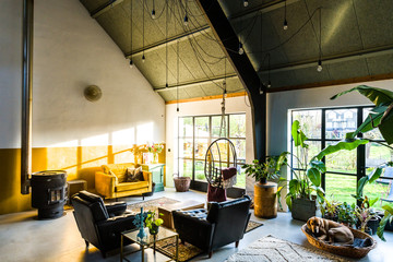 Loft style living room interior with design furniture. Scandinavian living. 