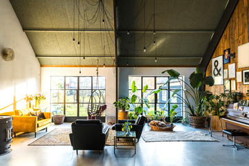 Loft style living room interior with design furniture. Scandinavian living. 