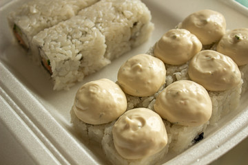 Different sushi in a take-away package. Japanese food