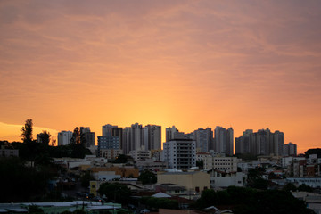 Fototapeta na wymiar Orange sky sunset on the city skyline, interior, Ribeirao Preto, Sao Paulo