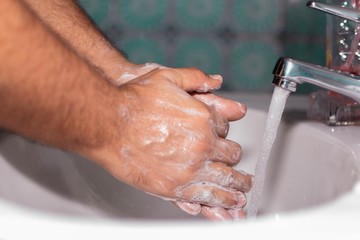 Man Washing his hands hygiene healt