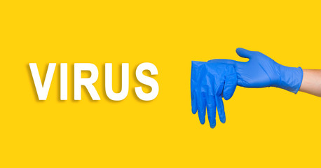 Fototapeta premium Man putting on a pair of latex gloves. Coronavirus, COVID-19, self-quarantine, isolation, social disdancing concept.