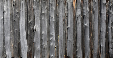 Old boards, a wooden peeled wall of brown color