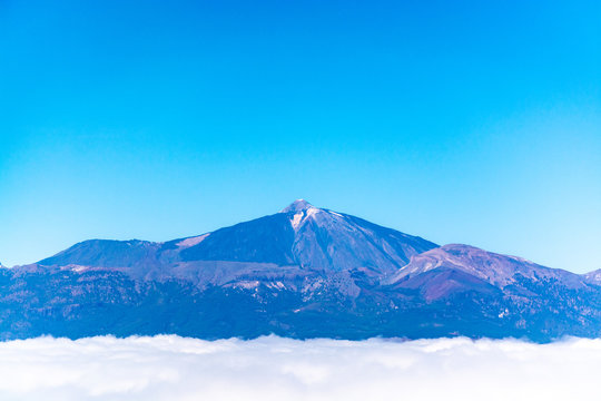 Aerial overcloud view on Tenerife island from airplane
