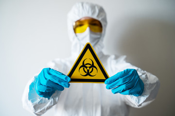 A doctor in a medical mask with the inscription quarantine shows a stop sign. COVID-19 epidemic