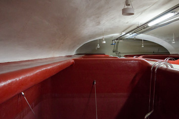 Bathtub in a brewery. Red bathtub.