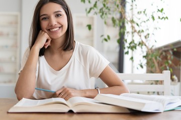 Obraz premium Coronavirus. Beautiful young woman working from home