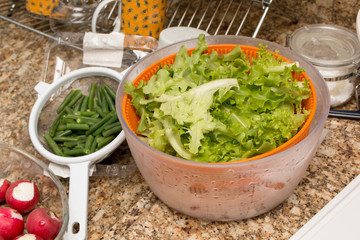 Ingredients for preparing a fresh salad in the kitchen