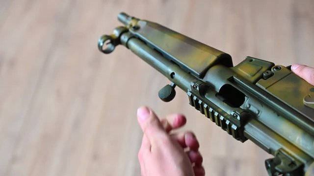 use of the loading lever of a submachine gun slow motion