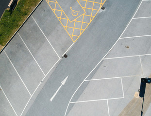 parking bay and disable parking bays from above photographed in an urban setting with a drone....