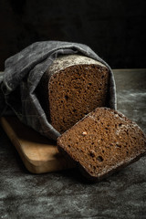 gluten free bread on a wood on a dark background