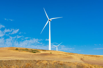 Modern wind mill and yellow fields in Andalusie, Spain