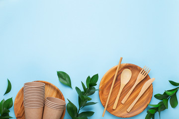 Recycling concept. Wooden cutlery and cups on plate