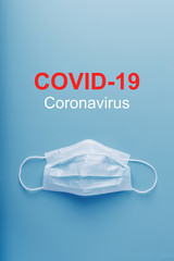Medical masks for protection against dangerous coronavirus infection with the inscription COVID-19.