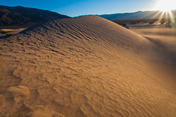 Sunset Over The  Mesquite Flat Sand Dunes With The Panamint Range and Tucki Mountain, Death Valley...