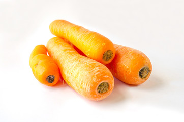 Raw carrots shot against a white background.