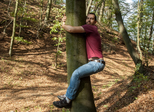 man love nature hug tree forrest save  planet, climate change, increases levels of hormone oxytocin, emotional bonding, healing benefits