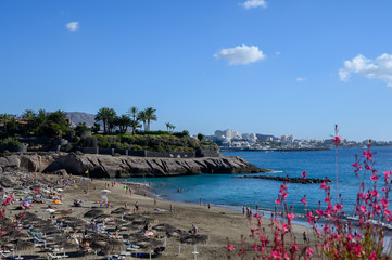 All year sun vacation destination, blue ocean water on  beach Playa del Duque in Costa Adeje, Tenerife island, Canary, Spain