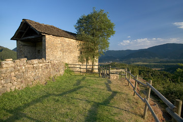 Fototapeta na wymiar Valley view and Casa de San Martin Inn, in Aragon, in the Pyrenees Mountains, Province of Huesca, Spain