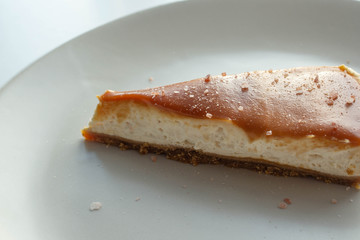 Cheesecake with salted caramel sauce on plate