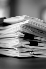 Pile of Papers with Binder Clips for Organizing