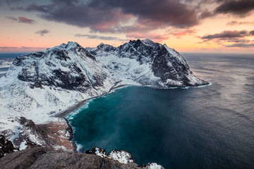 Scenery of Ryten mountain with Kvalvika beach on sunset at Lofoten Islands