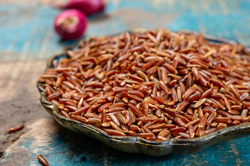 Bowl with wild long brown rice uncooked