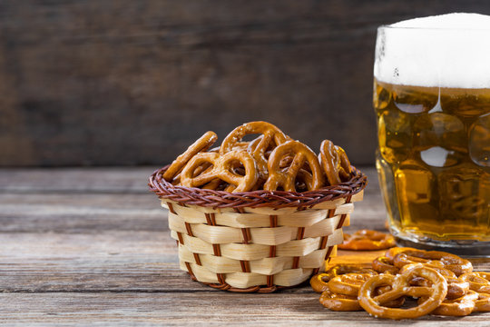 Beer snack for a party - salted hard pretzels on a wooden table