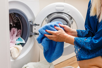 Housework: young woman doing laundry