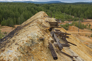 Dull landscape on abandoned mining site with surface dump