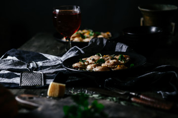 Ravioli with pumpkin and cheese on a dark background