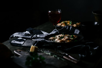 Ravioli with pumpkin and cheese on a dark background