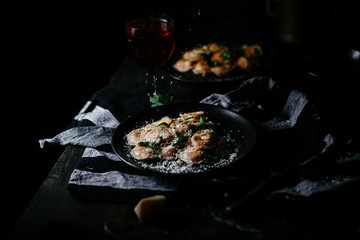 Ravioli with pumpkin and cheese on a dark background