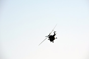 A multipurpose military helicopter PZL W-3 Sokół performing stunts in the blue sky during Nato...