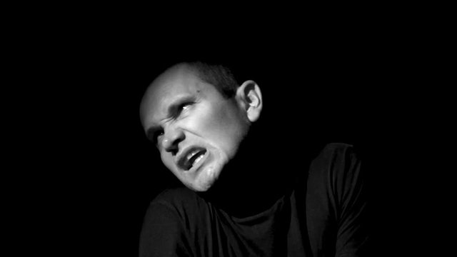Crazy Man Experiences A Attack Of Paranoia Looks In Camera