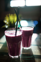 Fruit smoothie with blueberries on vegetable milk.
