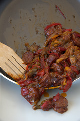 Sausage and peppers, cooked in the pan, traditional Greek food
