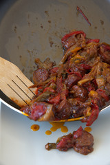 Sausage and peppers, cooked in the pan, traditional Greek food