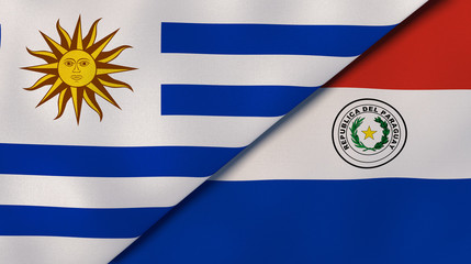 Obraz premium The flags of Uruguay and Paraguay. News, reportage, business background. 3d illustration