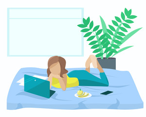 The girl is lying on the bed with a laptop