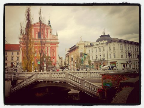 Triple Bridge Over Ljubljanica River Against Sky