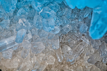 Druse of hyaline quartz illuminated by the light creating color effects