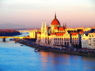 Fototapeta na wymiar View of the Hungarian Parliament Building and the Danube river at sunset in Budapest, Hungary.