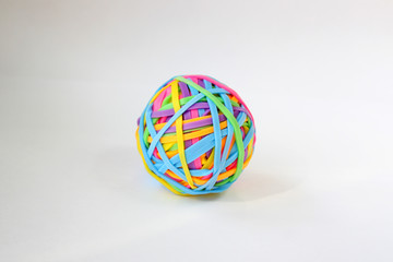 Stationery elastic band. Elastic rubber ball for money close-up.