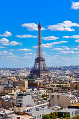 Fototapeta na wymiar PARIS, FRANCE, EUROPE -Eiffel Tower & blue sky with clouds, Paris, France - JULY 24, 2015
