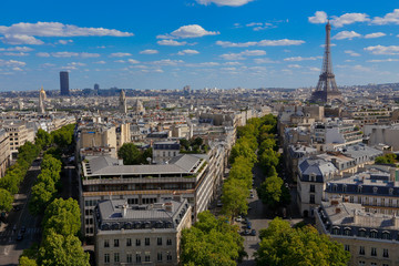 PARIS, FRANCE, EUROPE -Aerial view of Paris, France and Eiffel Tower as seen from the Arch of Triumph on a sunny day with white puffy clouds, shot August 4, 2015
